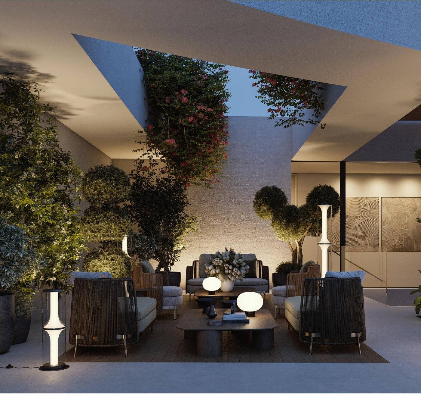 A private courtyard lounge at Lunaya, framed by lush vertical greenery