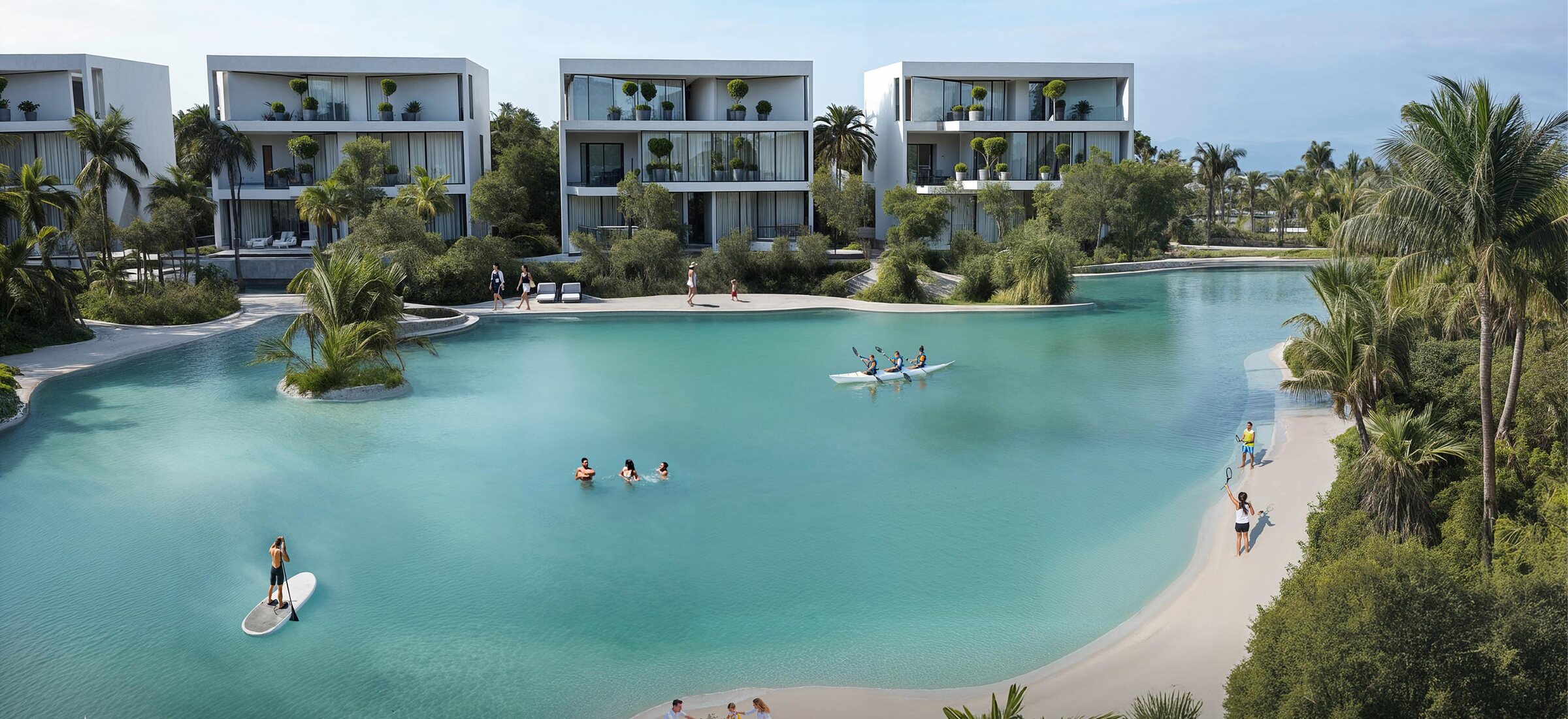 Aerial view of the swimmable crystal lagoon at Lunaya, with residents kayaking, paddleboarding and swimming beside low-density villas fringed by palms
